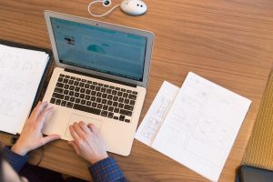 Typing on a laptop