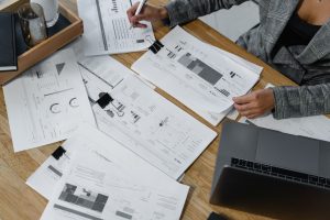 A woman looking at reports and projections