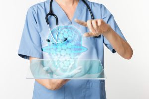 A doctor holding a tablet projecting a hologram