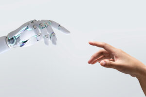 A human and robotic hand approaching each other